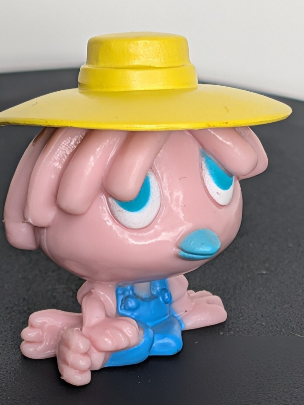 Pink & blue vintage 80s figurine with yellow hat